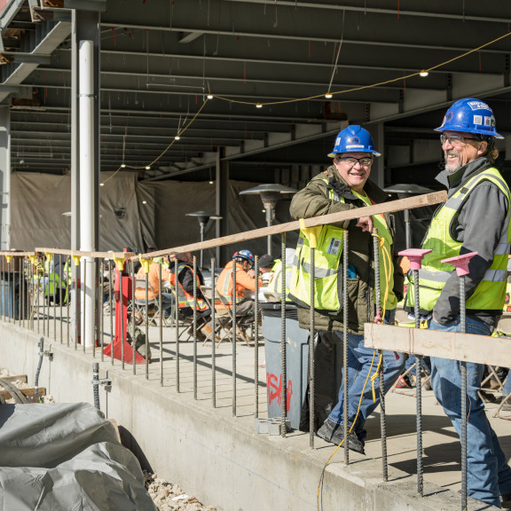 Workers on site at Concourse A East Topping Out ceremony October 13 2021