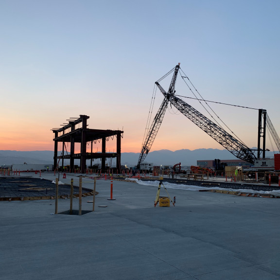 NCE steel erection and crane at sunrise
