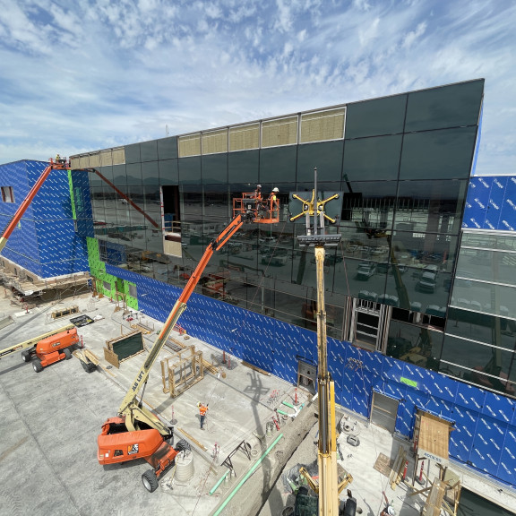 Phase 4 Concourse B east glass install June 2025